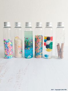 there are six bottles that have sprinkles in them