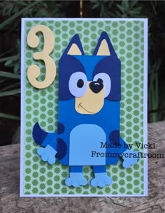 a card with a blue dog on it and the number three in front of it