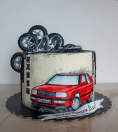 a birthday cake with a red car on it