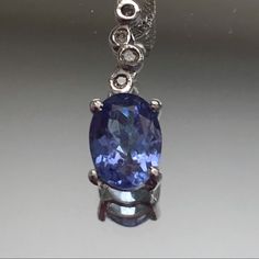 Tanzanite Diamond 14 Kt White Gold Necklace. 5 X 7 Mm Oval Tanzanite (Approx 0.7 Carats). Tanzanite Is Medium-Light Blue. 4 Small Diamond Accent Bubbles. Pendant Overall Is 5 X 15 Mm. 20 Inch Chain. 2g Smoke-Free Home. Not A Posh Member? Enter My Referral Code Dnsesq1 When You Join And Receive A $10 Credit. 20 Inch Necklace, White Gold Necklace, Tanzanite Diamond, White Gold Necklaces, Size 20, Womens Jewelry Necklace, Gold Necklace, Light Blue, Bubbles