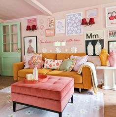 a living room filled with furniture and pictures on the wall