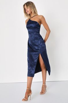 Arrive like a vision and leave everyone stunned in the Lulus Desirable Dream Navy Blue Satin Jacquard Halter Neck Midi Dress! Sleek woven satin jacquard (embossed with a pretty floral design) creates a modified, asymmetrical halter neckline and a princess-seamed bodice, supported by adjustable spaghetti straps. High, fitted waist sits atop a figure-skimming midi skirt with a sexy side slit. Hidden back zipper/clasp. Fit: This garment fits true to size. Length: Mid-calf length. Size medium measur Navy Blue Satin Dress, Halter Neck Midi Dress, Blue Satin Dress, Blue Halter Dress, Winter Wedding Guest Dress, Navy Blue Midi Dress, Fall Wedding Guest Dress, Blue Cocktail Dress, Ladies Clothing