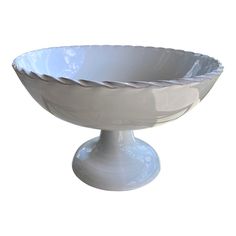 a white bowl sitting on top of a table