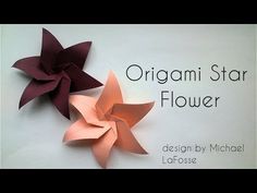 origami star flower displayed on white wall with caption in large format below