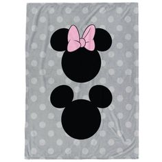 a blanket with minnie mouse ears on it and a pink bow in the middle,