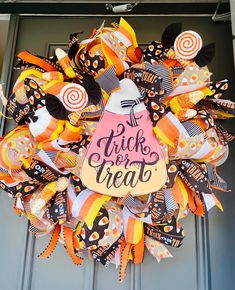 a halloween wreath that says trick or treat