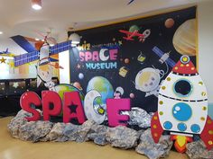 the space museum is decorated with rock and paper machs for children's birthday