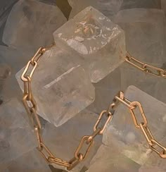 a gold chain is on top of ice cubes