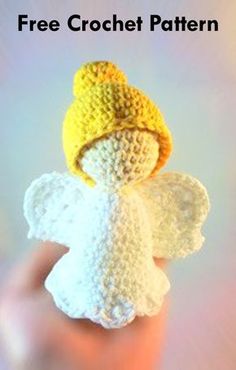 a crocheted angel with a yellow hat on it's head is shown