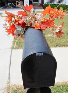 a mailbox with some flowers in it