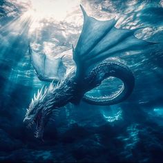 an underwater photo of a dragon swimming in the ocean