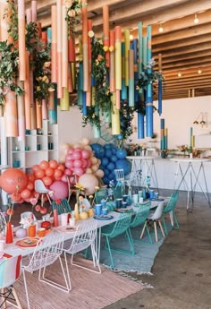 an outdoor party with colorful balloons and decorations