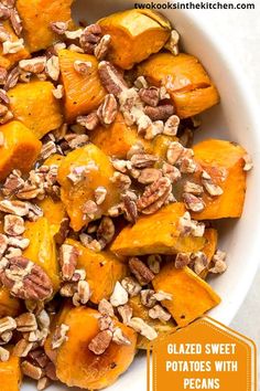 a white bowl filled with sweet potatoes and nuts