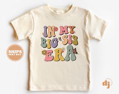 Big Sis Toddler Shirt - In My Big Sis Era Retro Kids Pregnancy Announcement Shirt - Sibling Natural Toddler & Youth Tee #6002 All of the shirts and bodysuits at our shop are CPSIA compliant. We only use Eco-friendly, water-based inks that are also CPSIA compliant and boasts strong washability (highest score on AATCC wash test).  So rest assure to put them on your little ones!  ** COLOR OF T-SHIRTS WILL VARY SLIGHTLY DUE TO LIGHTING AND/OR MONITOR SETTINGS ** DETAILS OF BABY BODYSUITS & T-SHIRTS MAY VARY SLIGHTLY FROM PRODUCT PHOTOS BASED ON AVAILABLE INVENTORY HOW TO ORDER: Please follow these 5 simple steps: 1. Select the style and size you want in the "Style (Size)" option.  2. Select the shirt color you want in the "Color" option. 3. [APPLICABLE ONLY ON CERTAIN LISTINGS] Follow the inst Birthday Ideas Outfits, Kids Birthday Shirt, Kids Birthday Shirts, Birthday 4, Kid Parties, Pregnancy Announcement Shirt, Retro Kids, Fourth Birthday, Shirt Business