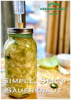 a jar filled with pickles sitting on top of a table