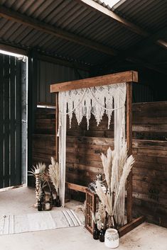 an outdoor area with a bed and some plants