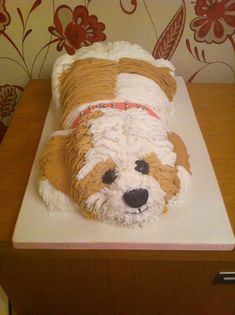 a cake shaped like a dog on top of a table