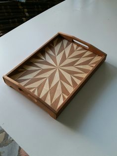 a wooden tray sitting on top of a table