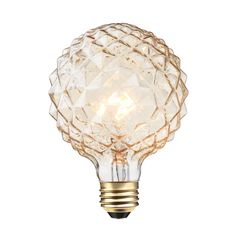 a light bulb that is on top of a white wall mounted fixture with an intricate design