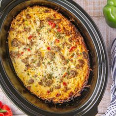 an overhead view of a casserole in a crock pot on a table