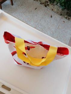 a paper bag sitting on top of a white tray