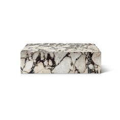 a marble box sitting on top of a white surface