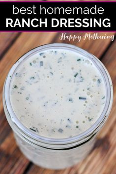 a mason jar filled with ranch dressing on top of a wooden table