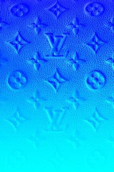 blue and green background with the letters louis vuitton written in cursive writing