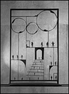 a drawing of people standing in front of a door with circles and stairs on it