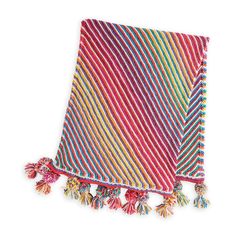 a multicolored blanket with tassels and pom poms on it