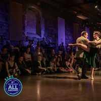 two people are dancing in front of an audience