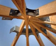 the underside of a wooden structure with metal brackets