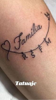 a tattoo with the word family written in cursive writing and an arrow on it