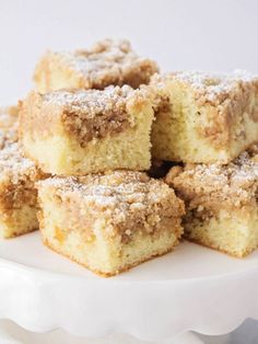 several pieces of cake on a plate with powdered sugar toppings in the middle