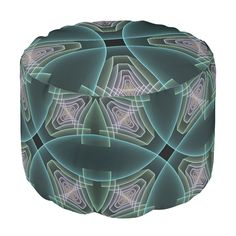 a round ottoman with an abstract design on the top and bottom, in blue and green