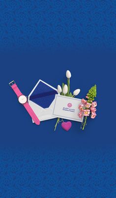 a blue background with an envelope, flowers and a pink watch on the left side