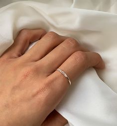 Minimal and dainty, perfect to wear alone or stack with other delicate rings. The blend of Baguette and tapered Baguette crystals make this a beautiful combo. .925 Silver Cubic Zirconia Baguette and Tapered Baguette Hypoallergenic, lead and nickel free Crystal Width 2mm x Length 11mm Band Width 1.5mm #R099-S Jewerly Set, Aesthetic Rings, Stackable Rings Silver, Minimal Ring, Baguette Ring, Handcrafted Rings, Moissanite Wedding Bands, Handmade Rings, Delicate Rings