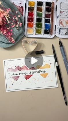 an artist's kit with watercolors and paint