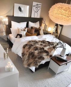 a bedroom with a large bed and white pillows