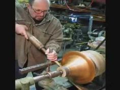 a man working on a machine in a shop