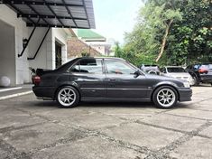 a black car parked in front of a building