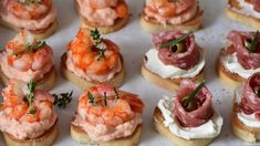 small appetizers are arranged on a tray ready to be eaten