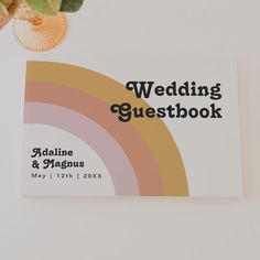 a wedding guest book sitting on top of a table