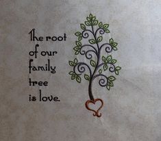 the root of our family tree is love written on a piece of paper with a heart