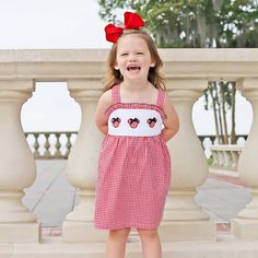 One of our most magical designs! This Mouse Ears Red Gingham Cara Dress is great for a trip to your favorite theme park, birthday celebrations, and play time. The red gingham Cara dress features cross traps and a ruffle hem. Also features our favorite mouse ears applique with a black bow. Park Birthday, Red Gingham, Tiny Humans, Mouse Ears, Birthday Celebrations, Girls Birthday, Black Bow, Birthday Outfit, Theme Park