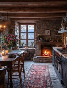 a dining room with a fire place in the middle and lots of furniture around it