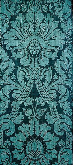 a blue and black wallpaper with an ornate design on it's side,