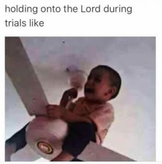 a baby is holding onto the lord during trials like