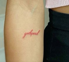 two people with tattoos on their arms that say,'godpeed'and have red ink