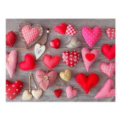 many hearts are arranged on a table with string and buttons in the shape of hearts